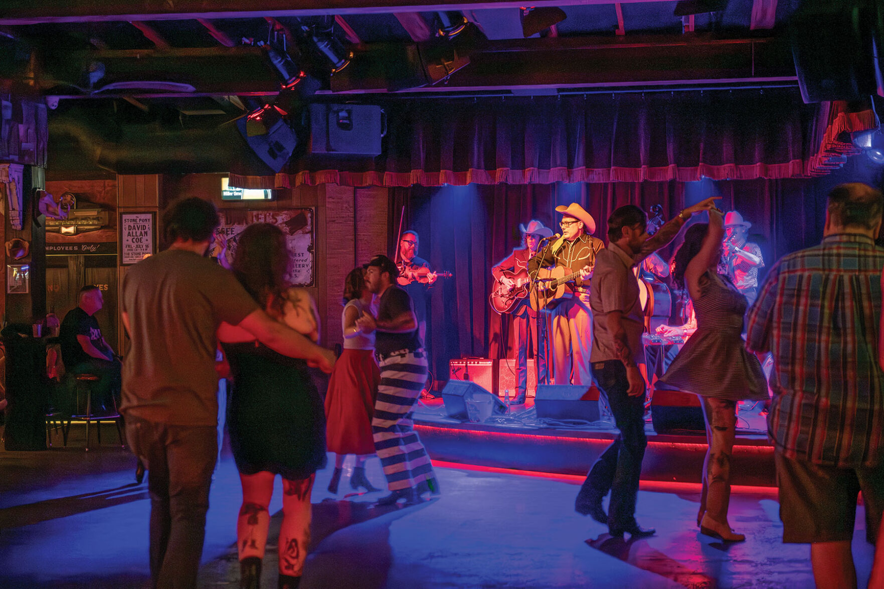 Couples dance to Chris Scruggs and the Stone Fox Five at Skinny Dennis